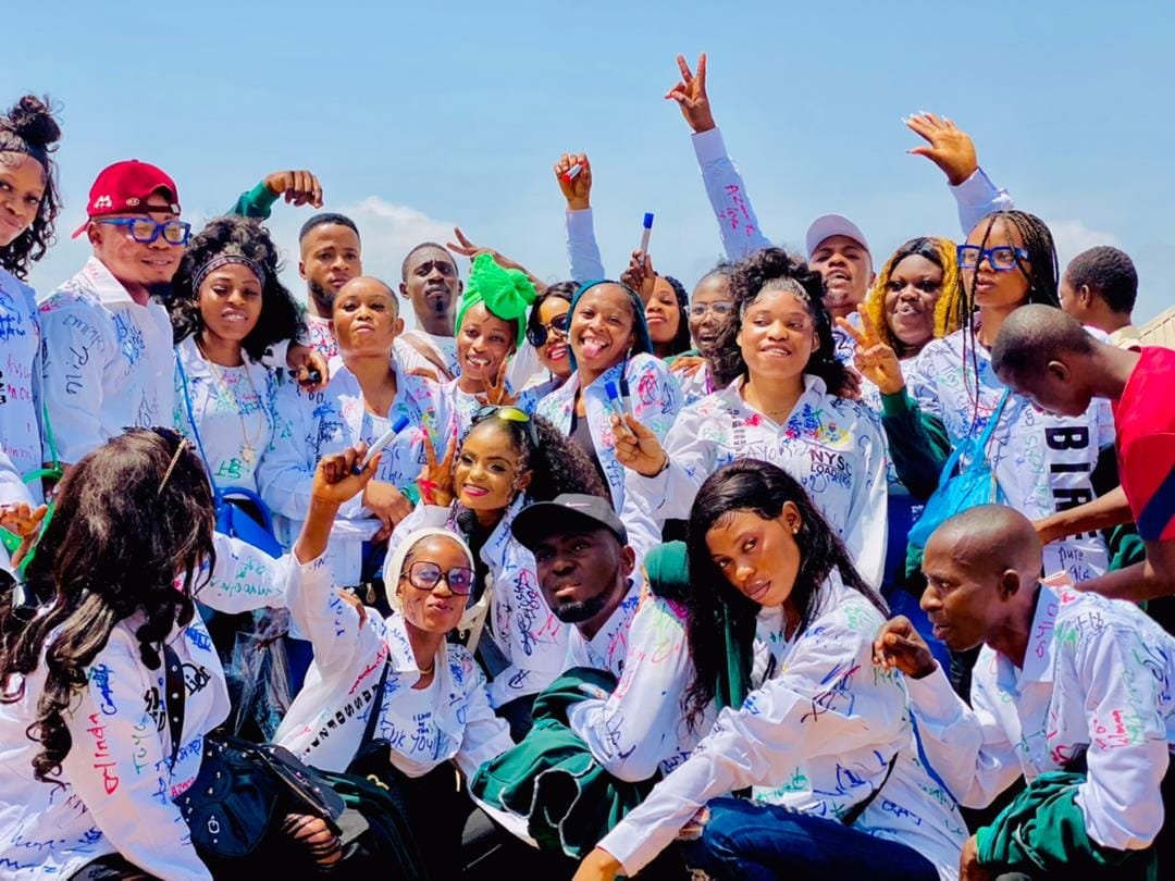 Final-year students celebrating at their signing-out ceremony